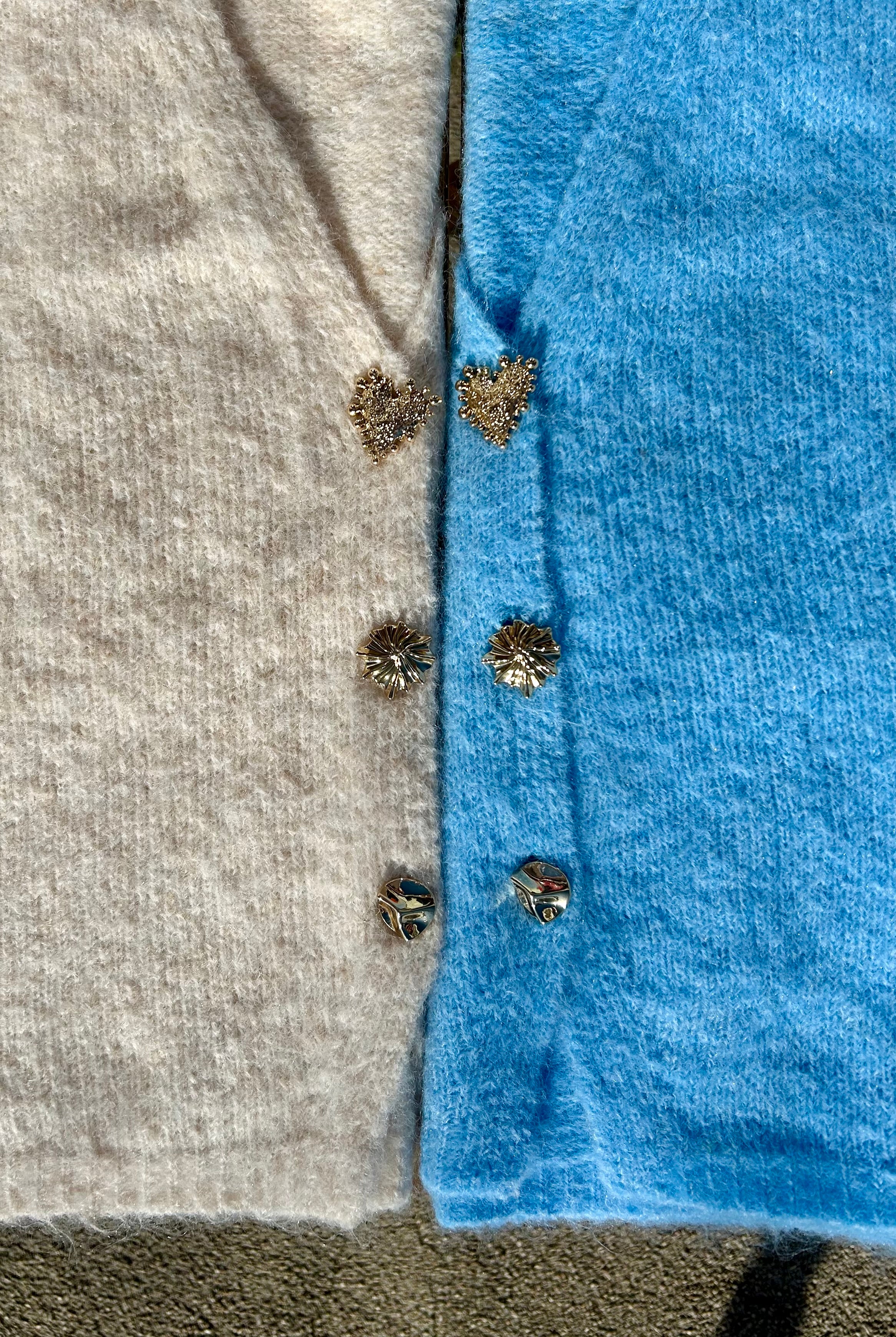 Pull sans manches à boutons fantaisies